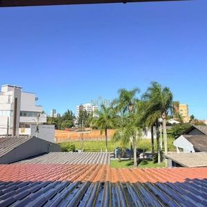 Casa com 228m², 3 dormitórios, 1 suíte, 2 vagas no bairro Stan em Torres para Comprar