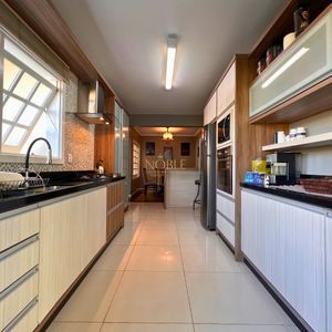 Casa com 184m², 3 dormitórios, 1 suíte, 2 vagas no bairro Igra Norte em Torres para Comprar