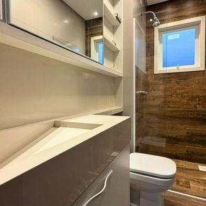 Casa com 200m², 3 dormitórios, 1 suíte, 2 vagas no bairro Praia Grande em Torres para Comprar