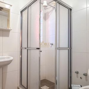 Apartamento com 100m², 2 dormitórios, 1 suíte, 1 vaga no Cayman em Torres para Comprar