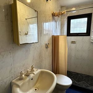 Apartamento com 94m², 3 dormitórios, 1 suíte, 2 vagas no Edifício Saron em Torres para Comprar