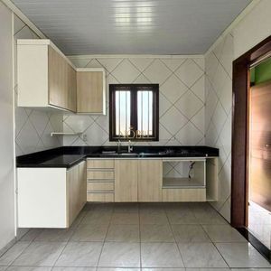 Casa com 74m², 2 dormitórios, 1 vaga no bairro Igra Sul em Torres para Comprar