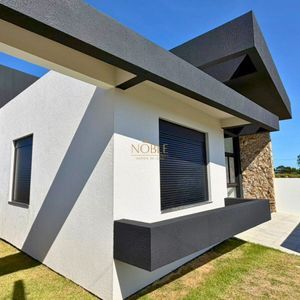 Casa com 146m², 3 dormitórios, 1 suíte, 2 vagas no Loteamento Jardim América em Passo de Torres para Comprar