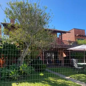 Casa com 247m², 5 dormitórios, 3 suítes, 3 vagas no bairro Praia Grande em Torres para Comprar
