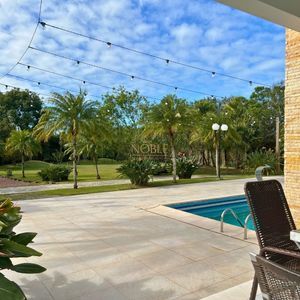 Casa com 600m², 4 dormitórios, 1 suíte, 4 vagas no bairro Igra Norte em Torres para Comprar