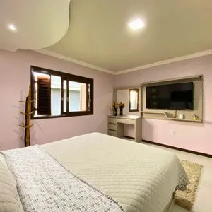 Casa com 148m², 3 dormitórios, 1 suíte, 2 vagas no bairro Morada das Palmeiras em Torres para Comprar