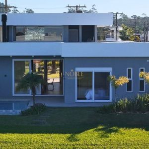 Casa de Condomínio com 264m², 4 dormitórios, 4 suítes, 2 vagas no Reserva das Águas em Torres para Comprar