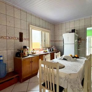 Casa com 101m², 2 dormitórios no bairro Igra Sul em Torres para Comprar