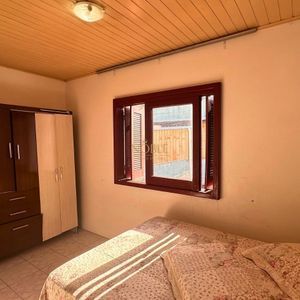 Casa, 6 dormitórios, 2 vagas no bairro Praia da Cal em Torres para Comprar