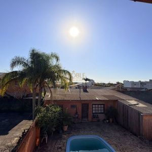 Casa, 6 dormitórios, 1 suíte, 4 vagas no bairro Stan em Torres para Comprar