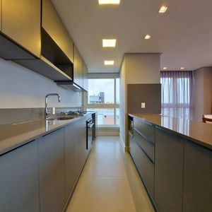 Apartamento com 102m², 3 dormitórios, 1 suíte, 2 vagas no Maui Residencial em Torres para Comprar
