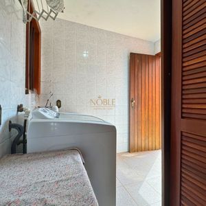 Casa com 220m², 4 dormitórios, 4 suítes, 2 vagas no bairro Igra Norte em Torres para Comprar