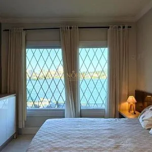 Casa com 243m², 4 dormitórios, 1 suíte, 2 vagas no bairro Stan em Torres para Comprar