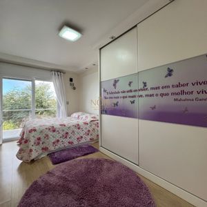 Casa com 600m², 4 dormitórios, 1 suíte, 4 vagas no bairro Igra Norte em Torres para Comprar