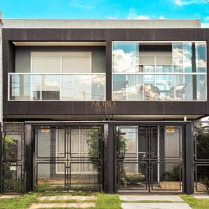 Geminado com 86m², 2 dormitórios, 2 suítes, 1 vaga no bairro Morada das Palmeiras em Torres para Comprar
