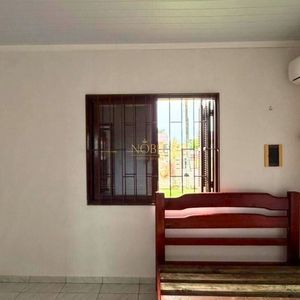 Casa com 74m², 2 dormitórios, 1 vaga no bairro Igra Sul em Torres para Comprar