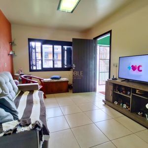 Casa, 6 dormitórios, 2 suítes, 3 vagas no bairro Getúlio Vargas em Torres para Comprar