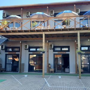 Pousada com 220m², 3 dormitórios, 1 suíte, 8 vagas no bairro Praia da Cal em Torres para Comprar