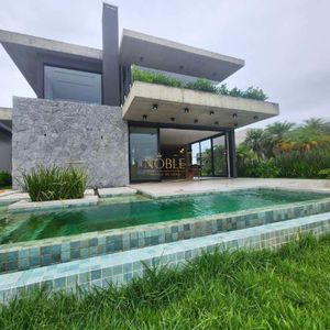 Casa de Condomínio com 390m², 4 dormitórios, 4 suítes, 2 vagas no Reserva das Águas em Torres para Comprar