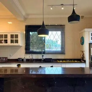 Casa com 243m², 4 dormitórios, 1 suíte, 2 vagas no bairro Stan em Torres para Comprar