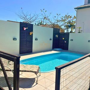 Casa com 240m², 4 dormitórios, 2 suítes, 2 vagas no bairro Praia Paraíso em Torres para Comprar