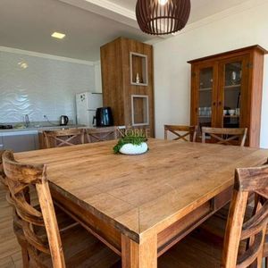 Casa com 120m², 3 dormitórios, 1 suíte, 2 vagas no bairro Loteamento Caravelle em Passo de Torres para Comprar