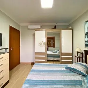 Casa com 272m², 4 dormitórios, 1 suíte, 3 vagas no bairro Igra Norte em Torres para Comprar