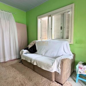 Casa com 101m², 2 dormitórios no bairro Igra Sul em Torres para Comprar