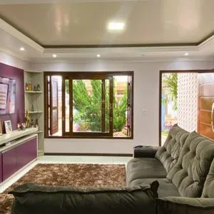 Casa com 148m², 3 dormitórios, 1 suíte, 2 vagas no bairro Morada das Palmeiras em Torres para Comprar