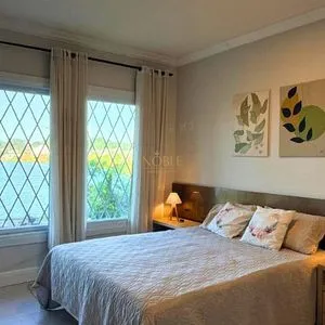 Casa com 243m², 4 dormitórios, 1 suíte, 2 vagas no bairro Stan em Torres para Comprar