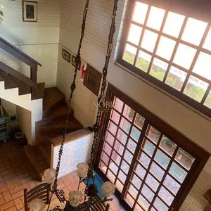 Casa com 247m², 5 dormitórios, 3 suítes, 3 vagas no bairro Praia Grande em Torres para Comprar