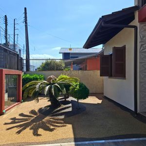 Casa, 3 dormitórios, 1 suíte, 2 vagas no bairro Stan em Torres para Comprar