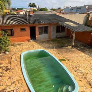 Casa, 6 dormitórios, 1 suíte, 4 vagas no bairro Stan em Torres para Comprar