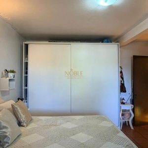 Casa com 228m², 3 dormitórios, 1 suíte, 2 vagas no bairro Stan em Torres para Comprar