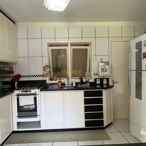 Sobrado com 290m², 4 dormitórios, 1 suíte, 2 vagas no bairro Igra Norte em Torres para Comprar