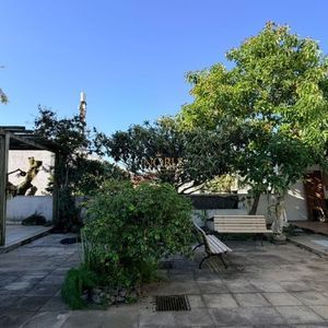 Casa com 400m², 5 dormitórios, 1 suíte, 4 vagas no bairro Stan em Torres para Comprar