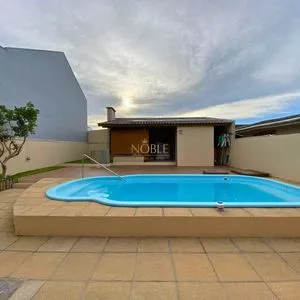 Casa com 272m², 4 dormitórios, 1 suíte, 3 vagas no bairro Igra Norte em Torres para Comprar