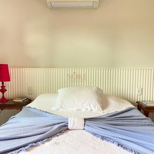 Casa com 518m², 5 dormitórios, 2 suítes, 2 vagas no bairro Praia Grande em Torres para Comprar