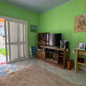 Casa com 101m², 2 dormitórios no bairro Igra Sul em Torres para Comprar