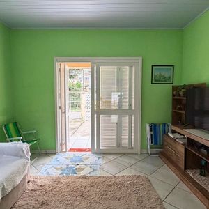 Casa com 101m², 2 dormitórios no bairro Igra Sul em Torres para Comprar