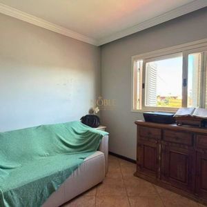 Casa com 209m², 3 dormitórios, 1 suíte, 2 vagas no bairro Igra em Torres para Comprar