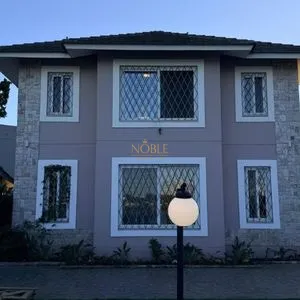 Casa com 243m², 4 dormitórios, 1 suíte, 2 vagas no bairro Stan em Torres para Comprar