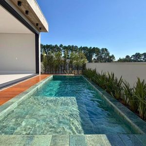 Casa com 335m², 4 dormitórios, 4 suítes, 2 vagas no Reserva das Águas em Torres para Comprar