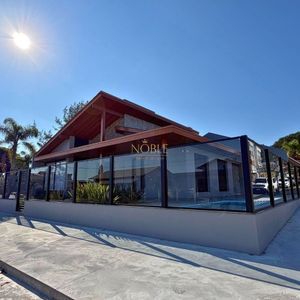 Casa com 180m², 3 dormitórios, 1 suíte, 2 vagas no bairro Praia da Cal em Torres para Comprar