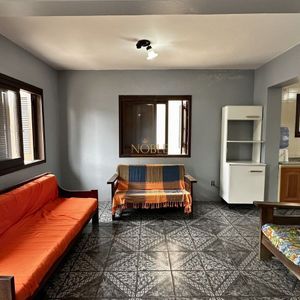 Apartamento com 94m², 3 dormitórios, 1 suíte, 2 vagas no Edifício Saron em Torres para Comprar