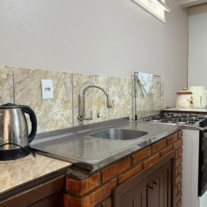 Casa com 171m², 4 dormitórios, 3 vagas no bairro Porto Alegre em Torres para Comprar