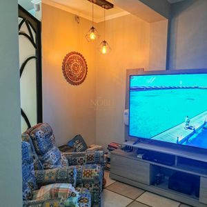 Sobrado com 330m², 3 dormitórios, 1 suíte, 5 vagas no bairro Centenário em Torres para Comprar