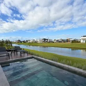 Casa de Condomínio com 277m², 3 dormitórios, 3 suítes, 2 vagas no Reserva das Águas em Torres para Comprar