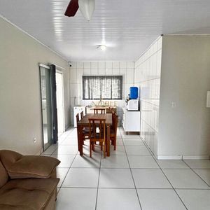 Casa com 125m², 3 dormitórios, 2 vagas no bairro Loteamento Caravelle em Passo de Torres para Comprar