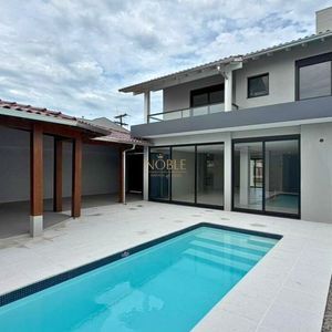 Casa com 284m², 4 dormitórios, 1 suíte, 2 vagas no bairro Igra Sul em Torres para Comprar